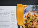 Read-A-Toni Pasta by Clem & Co.

It would be pre-pasta-rous if you didn’t get our Rigatoni bookmark. We are pasta-tive it will make you love to read-atoni even more!