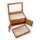 Our dramatic pen case for collectors, with new upgrades to accommodate larger styles. Part of the pleasure of being a pen lover is visual; a certain satisfaction ensues from being able to admire your favorites (and have others do the same). Our Lock and Key Pen Case offers more than an attractive space for displaying your prize pens—it also keeps your collection protected and free from dust. Unlock the wood inlay doors and lift the hinged protective glass lid to reveal the 4 drawers, each with 10 suede-line