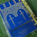 Step into a world of medieval wonder with this charming A6 binder notebook. Adorned with gothic architecture and noble knights rendered in shimmering golden foil, the cover transports you straight to a castle's grand halls.

Inside, a delightful coloring front page invites your creative touch, while 50 pages of luxurious cream 100 gsm paper await your thoughts, sketches, and stories. Perfect for journaling, note-taking, or artistic pursuits with a touch of enchantment.