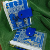 Step into a world of medieval wonder with this charming A6 binder notebook. Adorned with gothic architecture and noble knights rendered in shimmering golden foil, the cover transports you straight to a castle's grand halls.

Inside, a delightful coloring front page invites your creative touch, while 50 pages of luxurious cream 100 gsm paper await your thoughts, sketches, and stories. Perfect for journaling, note-taking, or artistic pursuits with a touch of enchantment.