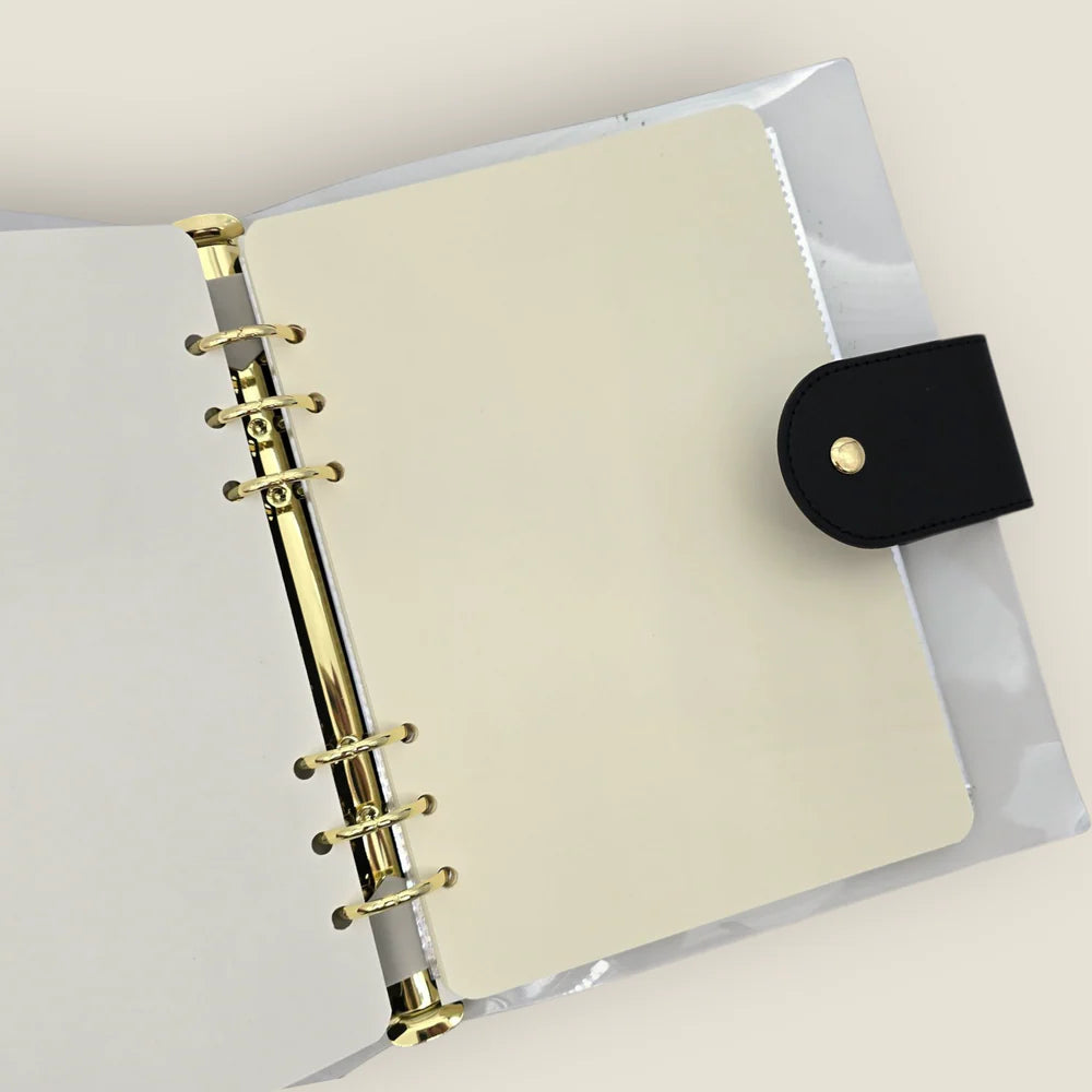 Stay organized and stylish on-the-go with our A5 Witch Organizer Binder—the perfect companion for crafting enthusiasts and stationery lovers alike! Featuring a mystical witch on black background and elegant golden accents, this binder adds a touch of magic to any workspace. Inside, you’ll find everything you need to keep your supplies secure and within reach.&nbsp;

Included with organizer:

5 Dual Vertical Sleeves: Ideal for storing PET tape cutouts or loops
2 Zipper Folders: Store postcards, stickers, and