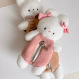 This soft and fuzzy pouch is perfect for carrying small essentials like coins, lip balm, or earbuds. Designed for convenience, it features a sturdy loop so you can easily attach it to your keychain, bag, or keyring.