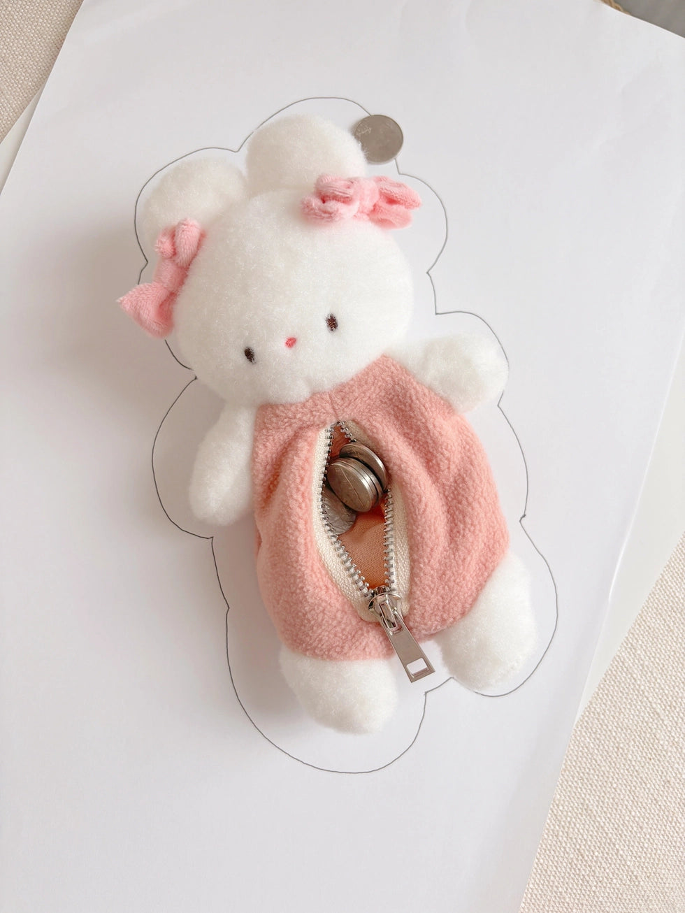 This soft and fuzzy pouch is perfect for carrying small essentials like coins, lip balm, or earbuds. Designed for convenience, it features a sturdy loop so you can easily attach it to your keychain, bag, or keyring.