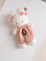 This soft and fuzzy pouch is perfect for carrying small essentials like coins, lip balm, or earbuds. Designed for convenience, it features a sturdy loop so you can easily attach it to your keychain, bag, or keyring.