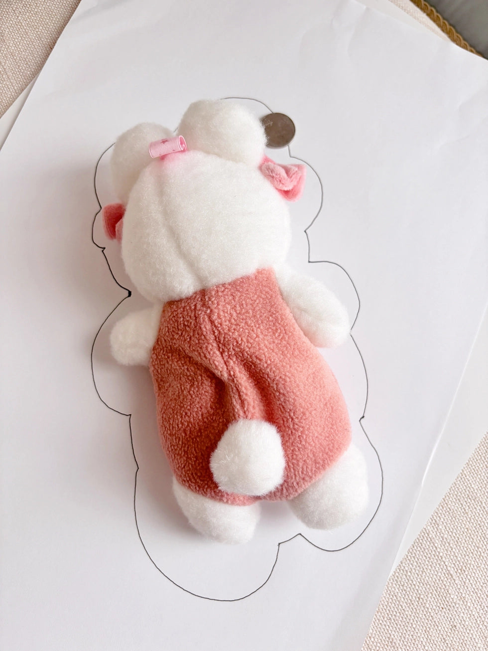 This soft and fuzzy pouch is perfect for carrying small essentials like coins, lip balm, or earbuds. Designed for convenience, it features a sturdy loop so you can easily attach it to your keychain, bag, or keyring.