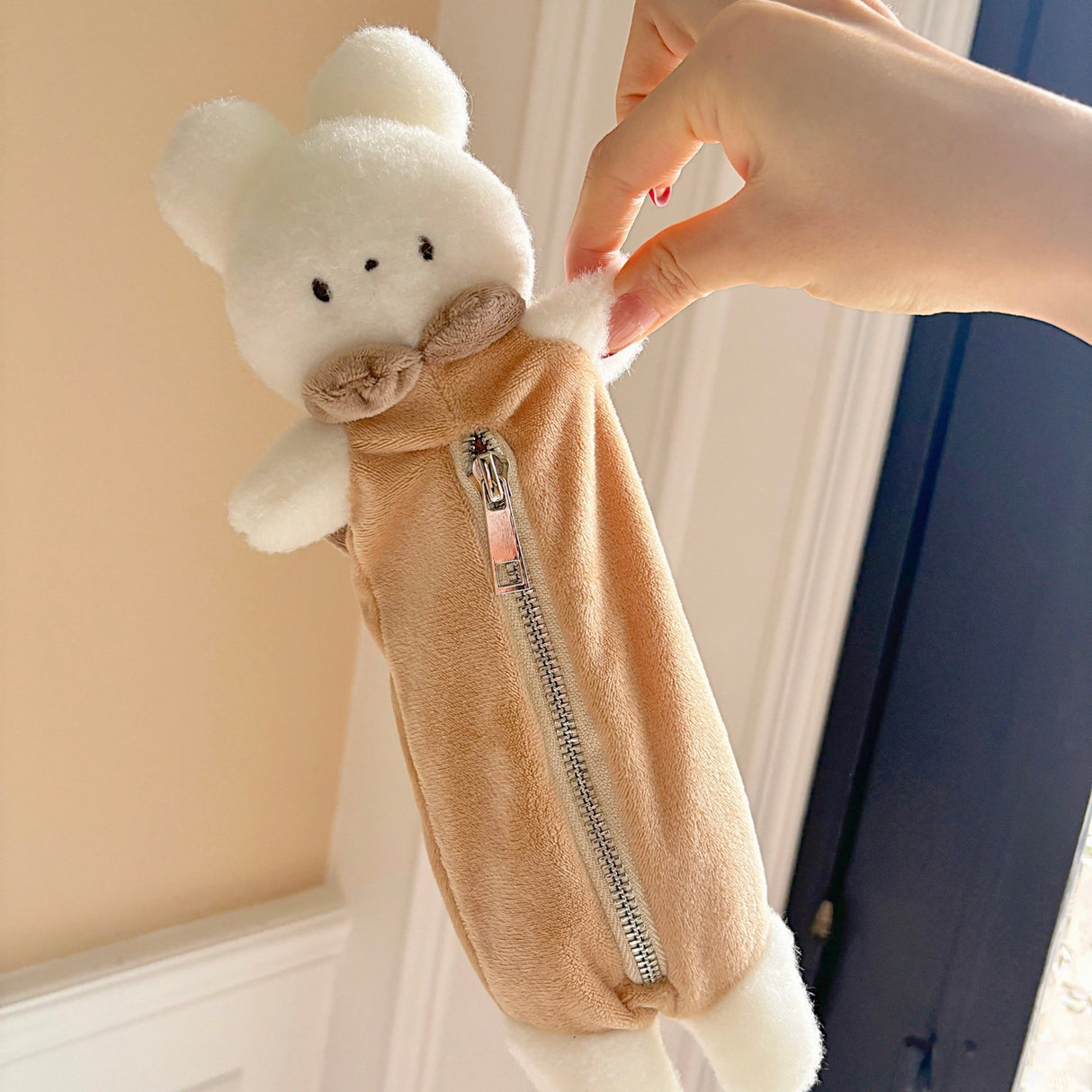 Keep your pens, pencils, and small essentials organized with this soft and fuzzy pencil pouch! With approximately 5.5 inches of storage space, it's perfect for carrying stationery, makeup brushes, or other daily must-haves. Its compact and lightweight design makes it easy to slip into your bag, while the sturdy zipper closure keeps everything secure.