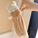 Keep your pens, pencils, and small essentials organized with this soft and fuzzy pencil pouch! With approximately 5.5 inches of storage space, it's perfect for carrying stationery, makeup brushes, or other daily must-haves. Its compact and lightweight design makes it easy to slip into your bag, while the sturdy zipper closure keeps everything secure.