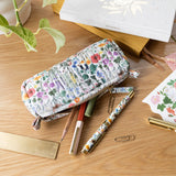 Each versatile pouch showcases premium quilted cotton in four distinct illustrated patterns, complemented by an elegant gold brass zipper with coordinating pull—adding a sophisticated finishing touch to these signature pieces.

Features:

Size: 7" x 3" x 2"
Premium quilted cotton exterior
Coordinating interior cotton lining
Gold brass zipper with matching pull
Versatile use as pencil pouch or makeup bag
Perfect for desk display or on-the-go organization