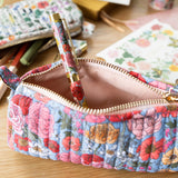 Cotton Quilted Pencil Pouch - Garden Flora

Each versatile pouch showcases premium quilted cotton in four distinct illustrated patterns, complemented by an elegant gold brass zipper with coordinating pull—adding a sophisticated finishing touch to these signature pieces.

Features:

Size: 7" x 3" x 2"
Premium quilted cotton exterior
Coordinating interior cotton lining
Gold brass zipper with matching pull
Versatile use as pencil pouch or makeup bag
Perfect for desk display or on-the-go organization
