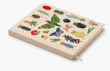 Our embroidered sketchbook is a large, hardcover journal with 108 unlined pages of thick paper perfect for sketching, drawing, and journaling. The cover is wrapped in cream book cloth and embroidered with the beetles and bugs of our Curio print with metallic gold accents. An attached grosgrain ribbon bookmark will save your place.