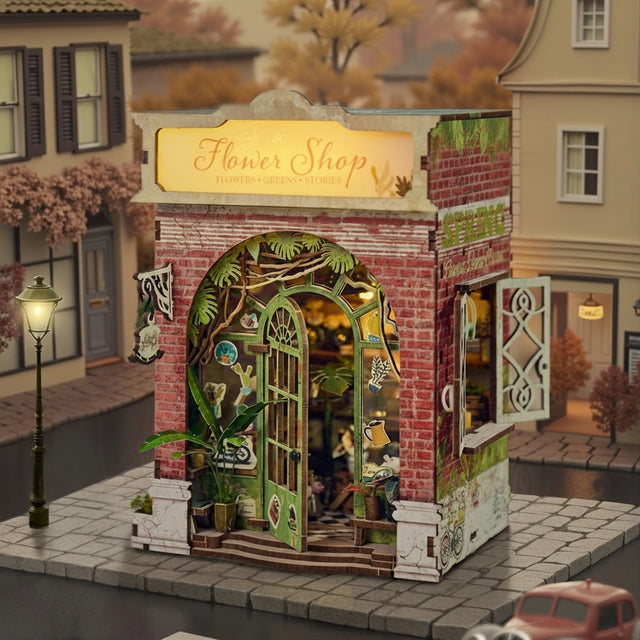 Step inside The Flower Shop, a cozy miniature haven where vibrant flower arrangements bloom in elegant vases, lush potted plants thrive, and fresh bouquets overflow with color. This delightful build features classic red brick walls, a welcoming wooden arched doorway, and a checkerboard floor that adds timeless charm.

2 AAA batteries required; batteries are not included.
Ages 14+
248 pieces
Assembled size: 4.53 x 3.94 x 7.4 inches