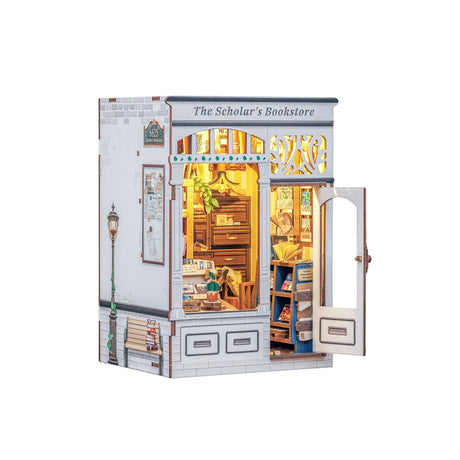 From the intricate woodwork of the storefront to the tiny posters, plants, and meticulously arranged reading materials inside, every piece invites you to slow down, take your time, and craft a scene that feels like a sanctuary for the soul. Whether you place it on your bookshelf or gift it to a fellow book lover, this book nook transforms any space into a story waiting to be told.