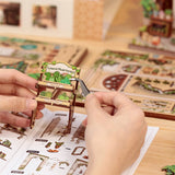 Bring the peaceful charm of a plant-filled bookstore to life with the Green Life Bookshop DIY book nook kit. Overflowing with greenery, potted plants, and botanical treasures, this enchanting miniature scene captures the magic of a cozy bookshop where nature and literature thrive together.