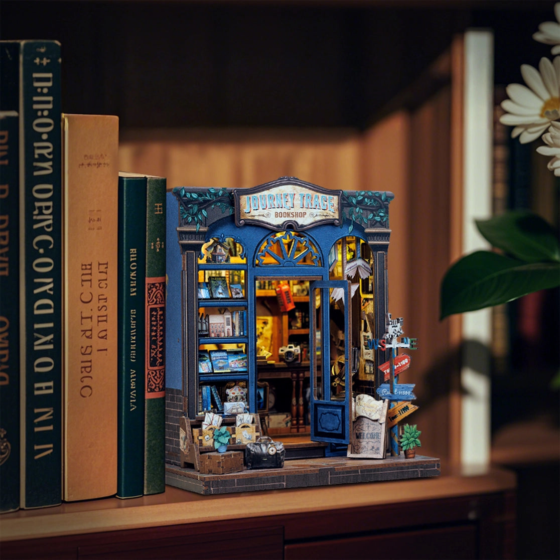 Inspired by the notion that "the meaning of travel is sharing," this charming book nook kit celebrates the power of storytelling, souvenirs, and cultural exchange. Visitors to this cozy bookshop explore a treasure trove of travelogues, handwritten postcards, globes, and keepsakes-each one brimming with whispered adventures from around the world. Let this miniature scene ignite your wanderlust, one tiny story at a time.
