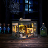 Step into a whimsical world of sugar, spells, and stardust with the Magic Café DIY Miniature House Kit. This enchanting build-it-yourself café brings to life a cozy little corner where witches, wizards, and woodland creatures gather for enchanted brews and magically infused pastries. Watch as tiny shelves fill with jars of mysterious ingredients, and the glass display case glows with cakes that sparkle with edible enchantments.

2 AAA batteries required; batteries are not included.
Ages 14+ 380 pieces
Assem