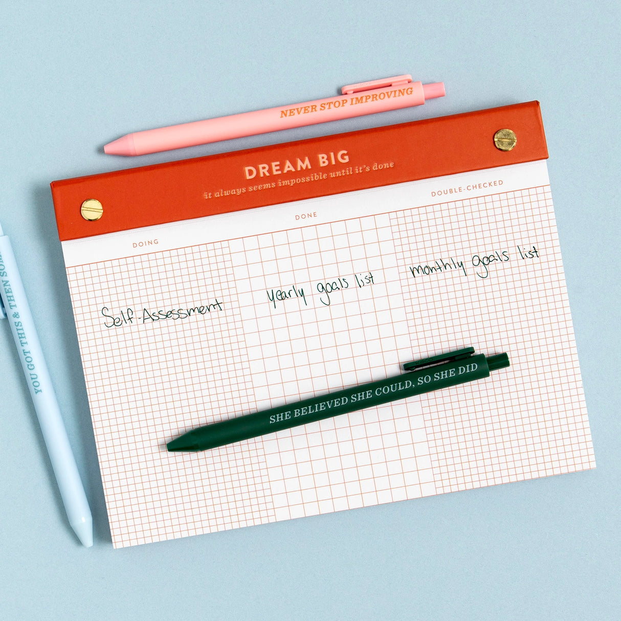 Turn your to-dos into ta-das with the Dream Big Notepad. This 6x8” desk pad features 75 grid pages organized into columns for Doing, Done, and Double-Checked—perfect for tackling big goals one step at a time. With smooth 120gsm paper, gold posts, and a bold red-orange header, it’s designed to keep you motivated and organized. The top-bound format and perforated pages make it easy to tear off and take with you. Ideal for goal-setters, planners, and productivity lovers. Makes a great gift for students, cowork