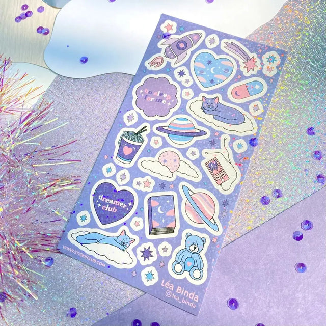 Blast off to dreamland with sleepy cats and rocket ships! 🚀☁️ Look closely and you’ll see this sheet has a little extra twinkle twinkle.✨

Art by: @lea_binda

Top Coating: Holo Rainbow
Adhesive Layer: Paper
Backing Layer: Clear PET