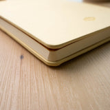 Embroidered Butter Yellow Blooms Hardbound Notebook

Premium embroidered cover and beautiful cream-colored lined pages making it easy to keep track of even the smallest details. Complete with a rich, satin ribbon allowing you to bookmark your favorite pages and experiences.

5.75" x 8.25" hardcover journal notebook
Embroidered cover artwork
144 lined pages
Glorious Smythe-sewn binding allows notebook to lay flat
Ribbon Bookmark
Durable binding and high-quality paper for a premium writing experience
Ideal fo