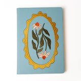 Embroidered Daisy Frame Hardbound Notebook

A premium hardcover notebook featuring precision embroidery on a vegan leather cover. Designed for everyday use, it includes smooth-lined pages, a Smythe-sewn layflat binding for effortless writing, and a satin ribbon to mark your place.

New inside page design
Soft Touch Embroidered Hardcover
5.75" x 8.25"
144 Lined Pages
Contrast Endpages
Satin Ribbon Bookmark &amp; Pen Loop
