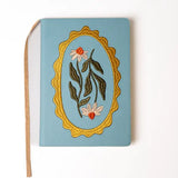 Embroidered Daisy Frame Hardbound Notebook

A premium hardcover notebook featuring precision embroidery on a vegan leather cover. Designed for everyday use, it includes smooth-lined pages, a Smythe-sewn layflat binding for effortless writing, and a satin ribbon to mark your place.

New inside page design
Soft Touch Embroidered Hardcover
5.75" x 8.25"
144 Lined Pages
Contrast Endpages
Satin Ribbon Bookmark &amp; Pen Loop