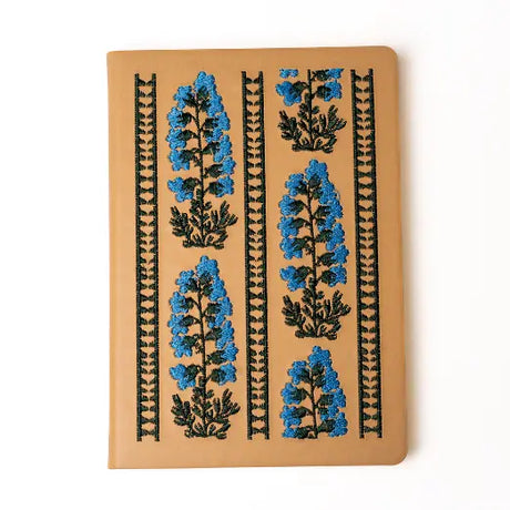 Embroidered Delphinium Flower Hardbound Notebook

A premium hardcover notebook featuring precision embroidery on a vegan leather cover. Designed for everyday use, it includes smooth-lined pages, a Smythe-sewn layflat binding for effortless writing, and a satin ribbon to mark your place.

New inside page design
Soft Touch Hardcover
5.75" x 8.25"
144 Lined Pages
Contrast Endpages
Satin Ribbon Bookmark &amp; Pen Loop