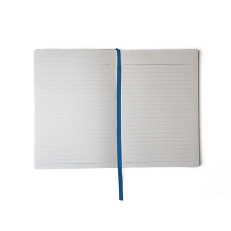 Embroidered Delphinium Flower Hardbound Notebook

A premium hardcover notebook featuring precision embroidery on a vegan leather cover. Designed for everyday use, it includes smooth-lined pages, a Smythe-sewn layflat binding for effortless writing, and a satin ribbon to mark your place.

New inside page design
Soft Touch Hardcover
5.75" x 8.25"
144 Lined Pages
Contrast Endpages
Satin Ribbon Bookmark &amp; Pen Loop