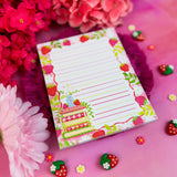 Stay organized in style with this adorable Strawberry Book Stack Notepad! Perfect for jotting down your daily tasks, goals, and bookish ideas, this notepads brings a pop of personality to your desk. Featuring a sturdy cardboard back and premium 70lb. uncoated paper, it's built to last through all your planning adventures.&nbsp;

✦ DETAILS ✦

Size: 4.25" x 5.5"
70 lb. Paper Uncoated

Padded With Cardboard Back

50 Sheets
No magnet backing