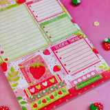 Stay organized in style with this adorable Strawberry Book Stack Daily Planner Notepad! Perfect for jotting down your daily tasks, goals, and bookish ideas, this notepads brings a pop of personality to your desk. Featuring a sturdy cardboard back and premium 70lb. uncoated paper, it's built to last through all your planning adventures.&nbsp;

✦ DETAILS ✦

Size: 5.5" x 8.5"

70 lb. Paper Uncoated

Padded With Cardboard Back

50 Sheets
No magnet backing