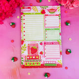 Stay organized in style with this adorable Strawberry Book Stack Daily Planner Notepad! Perfect for jotting down your daily tasks, goals, and bookish ideas, this notepads brings a pop of personality to your desk. Featuring a sturdy cardboard back and premium 70lb. uncoated paper, it's built to last through all your planning adventures.&nbsp;

✦ DETAILS ✦

Size: 5.5" x 8.5"

70 lb. Paper Uncoated

Padded With Cardboard Back

50 Sheets
No magnet backing