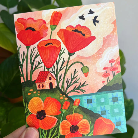 Emmylou Illustrations - Orange Poppy Cottage Greeting Card

Spring or Summer greeting card featuring colorful orange poppies, cozy cottage, and a quilted lake/ocean. Perfect for anniversaries, birthdays, Mother’s Day, housewarming, or just because! All greeting cards are hand illustrated by me!&nbsp;

Printed on premium heavyweight matte cardstock, this A2 card is blank inside—ready for your handwritten notes.

Includes a kraft envelope