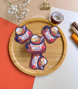 Cozy up with this adorable Fall Into Reading sticker, perfect for book lovers, autumn vibes, and anyone who enjoys warm drinks and cozy nights.