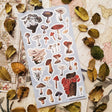🍄🌿 Wander into a woodland where every fallen log, mossy hollow, and shaded forest floor hides a tiny treasure. From oyster clusters and scarlet caps to intricate morels and velvety violets, this vintage-inspired set celebrates mushrooms as a lovely gathering of curious specimens for anyone enchanted by the wild, mysterious world of the forest floor.

One sticker sheet is included.
Top Coating: None
Adhesive Layer: Paper
Backing Layer: Clear PET
Size: 6.69"x3.54"
Weight-0.03oz