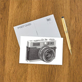 Elevate your inventory with this classic 3.5" x 5.5" postcard featuring an image from our Photography & Film Related collection titled Camera with Built-in Flash.