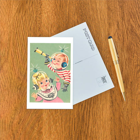 Elevate your inventory with this classic 3.5" x 5.5" postcard featuring an image from our Outer Space collection titled Children in Spacesuits.