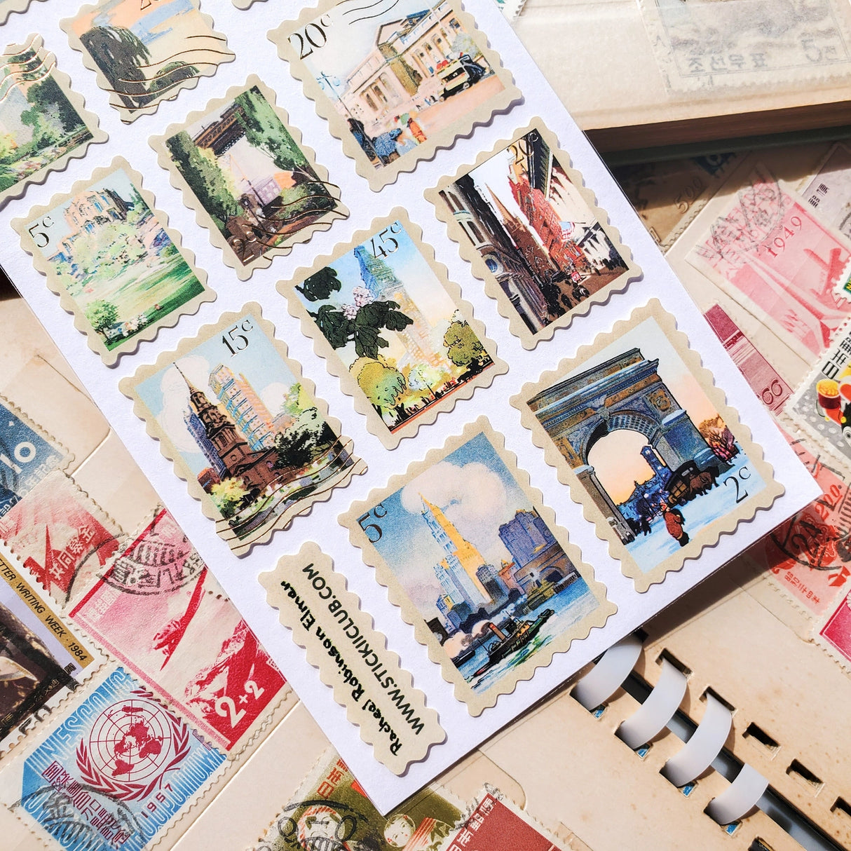 🏙🗽 Explore vintage NYC through these dreamy watercolor sticker stamps by artist Rachael Robinson Elmer. From snow-dusted Washington Square to sun-drenched harbor views, it’s a love letter to the Big Apple, one postage stamp at a time.