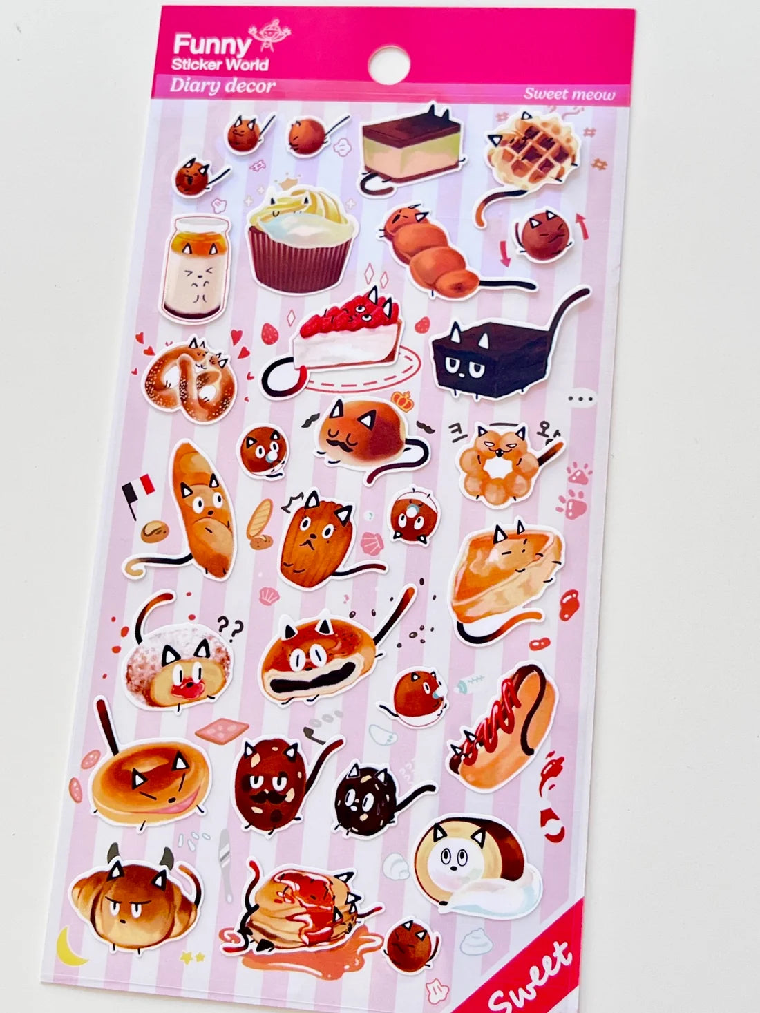 Funny Sticker World - Sweet Meow Sticker Sheet

Add a dash of delicious charm to your journal, planner, or happy mail with the sweet meow sticker sheet from Funny Sticker World. Featuring adorable dessert cat characters, this sheet brings a playful, cozy vibe to any creative project.

Sticker sheet&nbsp;
Includes 1 sticker sheet