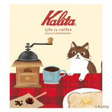 Furukawashiko x Kalinta Memo Pad - Black Coffee Kalita coffee brand poster with a coffee grinder, cup of coffee, cat, and toast on a red checkered tablecloth.