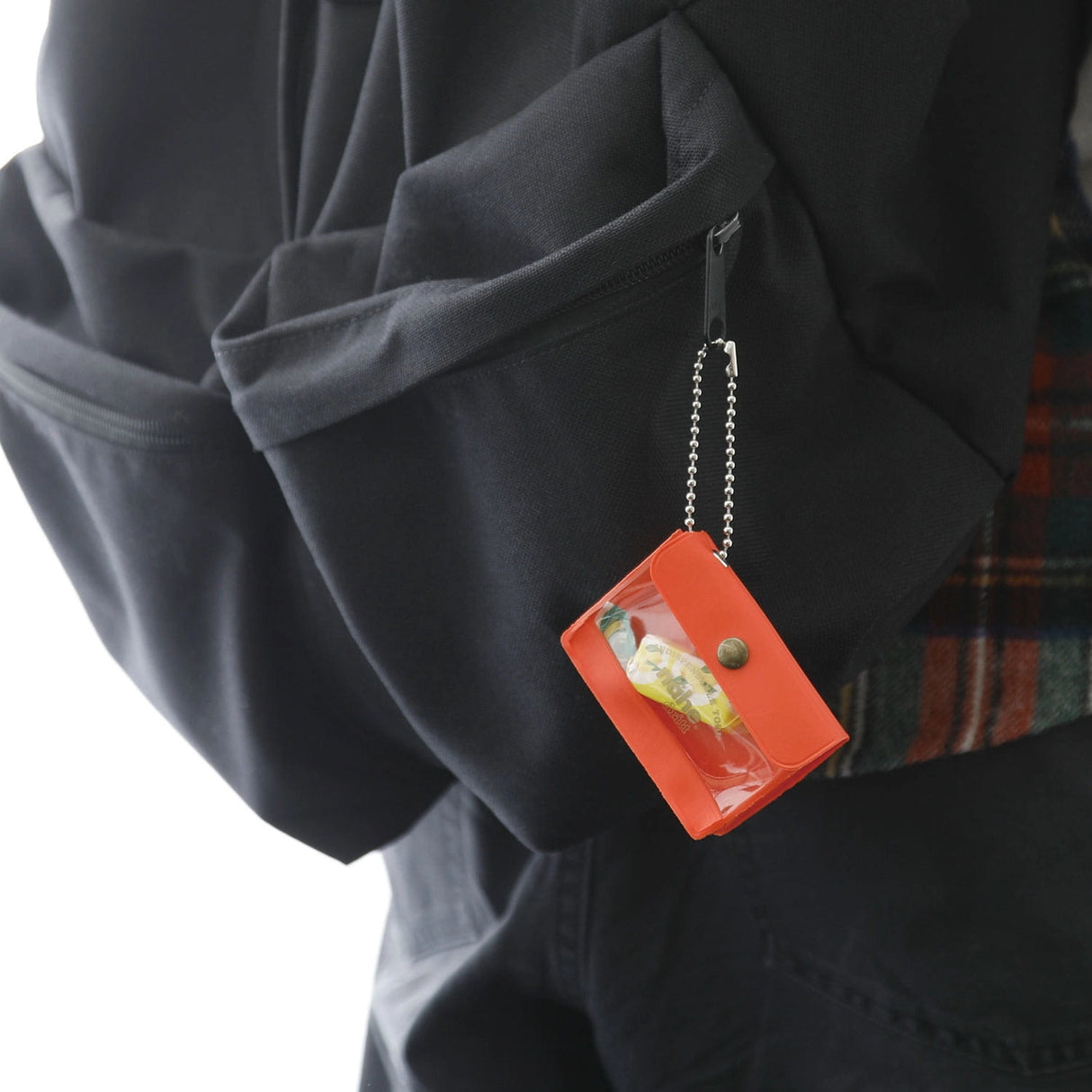 A miniature keychain version of the popular General Purpose Case by nähe. The true-to-original case comes with a clear front pocket with extra inserts inside and out. A ball chain securely attached to the corner of the case lets you hang it onto your keys or bags, perhaps in multiples.

Perfect size to travel with and quickly access your keys, coins, medicine, or small accessories.&nbsp;