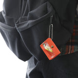 A miniature keychain version of the popular General Purpose Case by nähe. The true-to-original case comes with a clear front pocket with extra inserts inside and out. A ball chain securely attached to the corner of the case lets you hang it onto your keys or bags, perhaps in multiples.

Perfect size to travel with and quickly access your keys, coins, medicine, or small accessories.&nbsp;