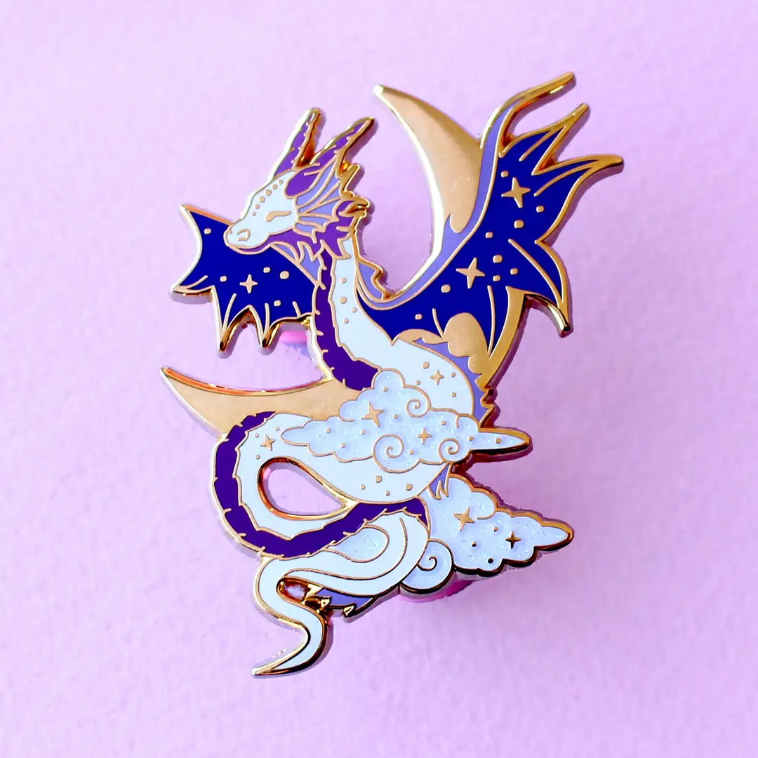Glitter Punk - Celestial Dragon Enamel Pin

This fabulous starry Celestial Dragon pin is perfect for fans of the mythical!

Made from gold hard enamel, this 48mm purple dragon is surrounded with glittery clouds and a large gold crescent moon. It is secured with two purple heart rubber clasps.