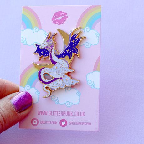 Glitter Punk - Celestial Dragon Enamel Pin

This fabulous starry Celestial Dragon pin is perfect for fans of the mythical!

Made from gold hard enamel, this 48mm purple dragon is surrounded with glittery clouds and a large gold crescent moon. It is secured with two purple heart rubber clasps.
