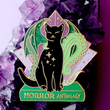 Horror Anthology Enamel Pin; Art Deco Black Cat dark academia literary book cat pin

The 1920s is an iconic time for horror, and this creepy but cute Horror Anthology cat is the perfect way to show off your love for the genre!

It features a black cat perched on a green book with wings and tentacles from indescribable creatures from the deep.