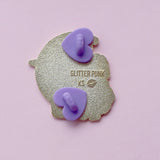 Celebrate your Pride with this fabulous Pansies Cat pin!

It features a black cat in front of a sparkly purple moon, next to some pansies in the black, grey, white & purple colours of the Ace Pride flag.

Each pin has a pair of heart shaped rubber pin backs, and is presented on a Pride themed Glitter Punk backing card. This pin is part of my Pride Cats collection, a 10-part set of enamel pins celebrating pride!

Measurements: 39mm (1.53”)
