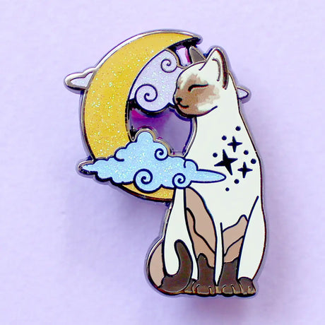 Glitter Punk - Pointed Cat Enamel Pin

Affectionate, clever and loud - there's no feline with the personality quite like a pointed cat!

This super sweet enamel pin depicts a pointed cat in a relaxed moment, in front of a glittery moon and clouds.