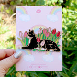 Cats love nothing better than relaxing in a flower bed – and this cute cat is no exception! This awesome embroidered patch features a black and white tuxedo cat lying down in some pink tulips.

Beautifully woven with black, white, pink, green and gold threads, this fabulous patch with brighten up any coat, bag or hat!

Measurements: 100mm wide