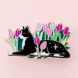 Cats love nothing better than relaxing in a flower bed – and this cute cat is no exception! This awesome pin features a black and white tuxedo cat lying down in some pink tulips.

Measurements: 42mm 