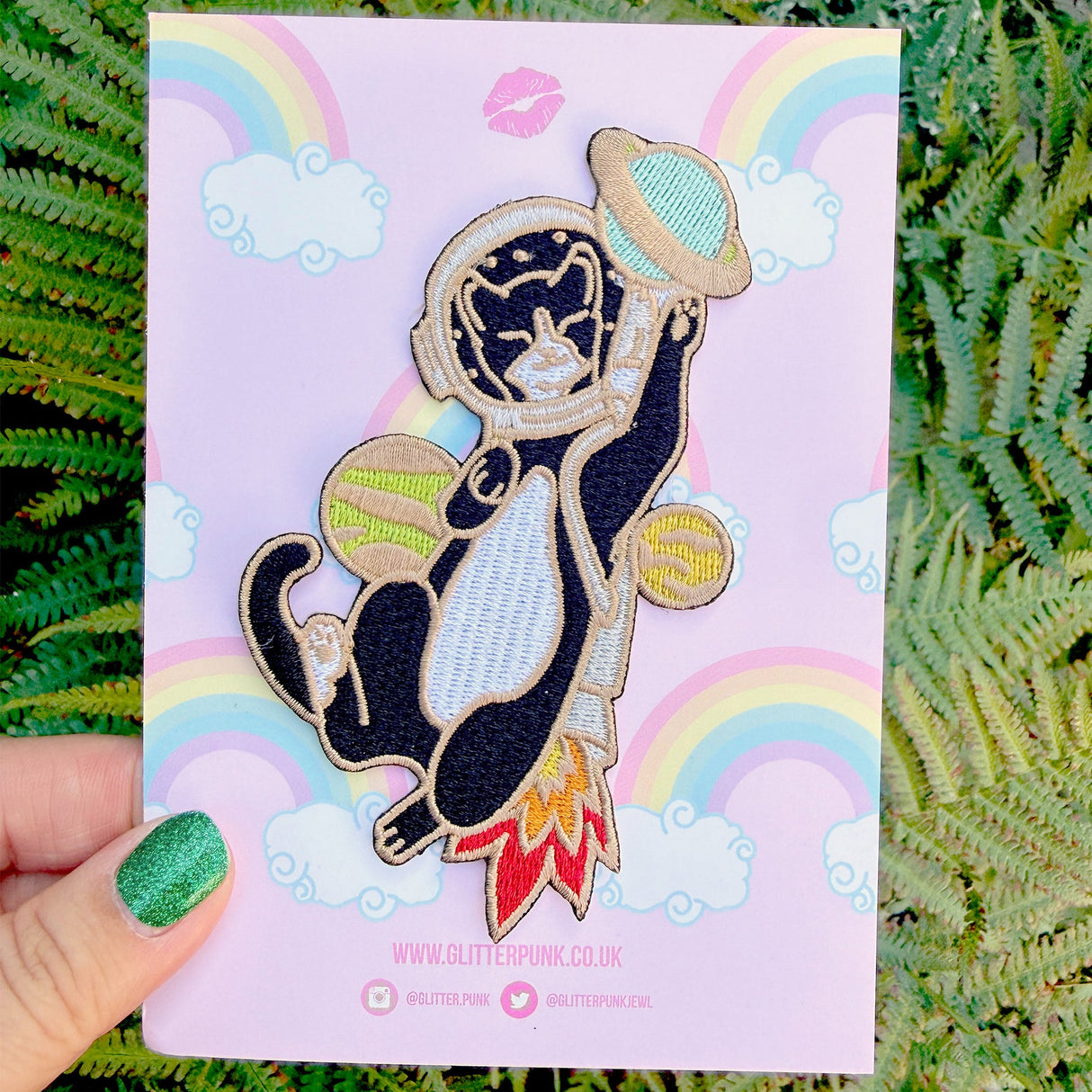 This awesome Astronaut Cat patch features a tuxedo cat with a helmet and rocket ship playing with some planets.

Beautifully woven with multi coloured threads, this fabulous patch with brighten up any coat, bag or hat!

Measurements: 64mm x 110mm