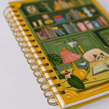 For cat lovers, book lovers, and anyone who believes planning should be delightful, the Cat Library Undated Weekly Planner brings a playful twist to everyday organization. The cover features a vintage-inspired library scene where curious cats lounge, climb, and quietly cause chaos among the shelves. Finished with gold foil details and gold wire binding, this planner feels whimsical yet polished.