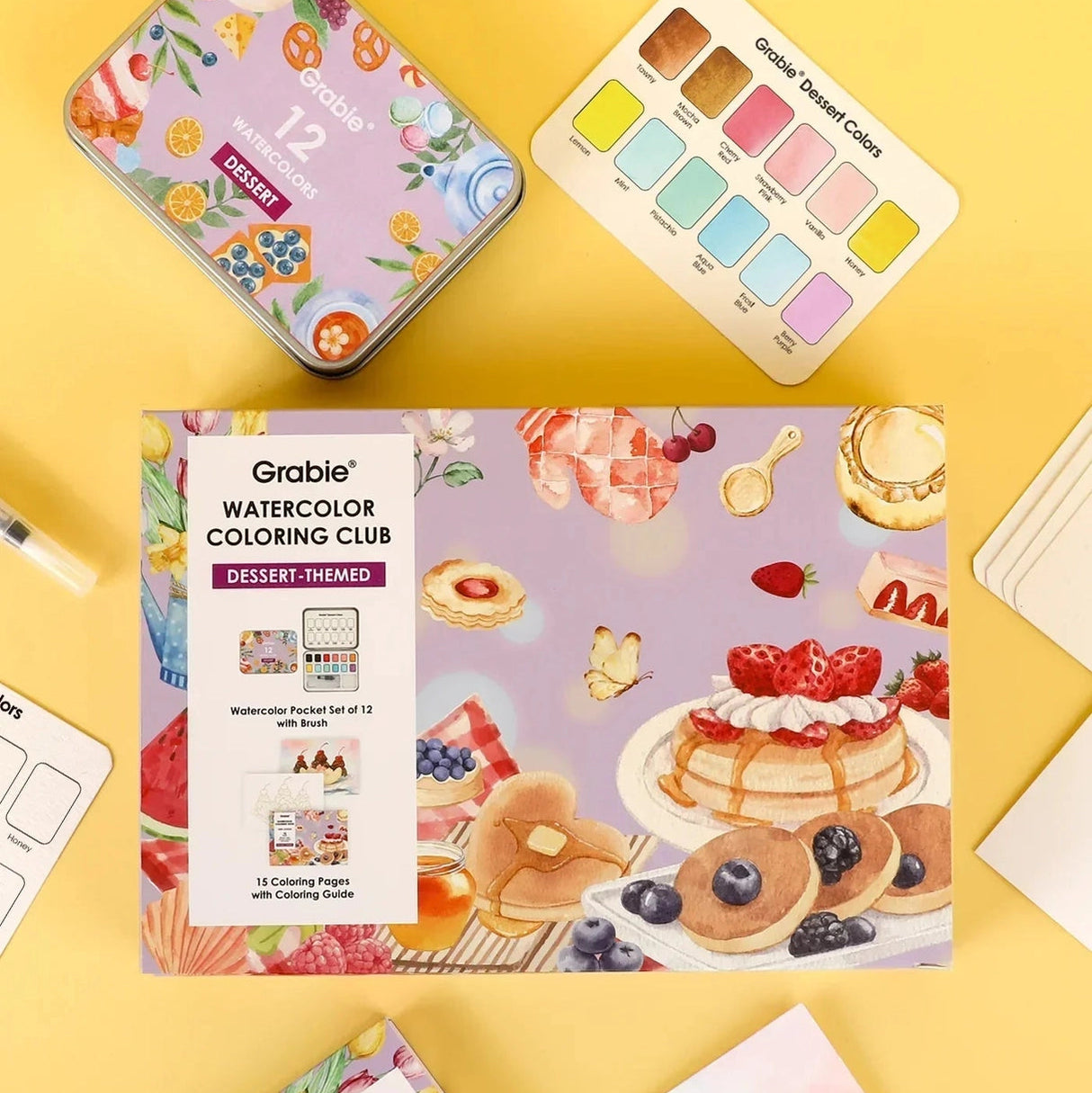 INDULGE YOUR CREATIVITY
Treat yourself to the sweetest watercolor adventure and build a colorful haven for your imagination. This delightful bundle comes with our custom 12-color Dessert palette and a whimsical coloring book featuring 15 pages of mouth-watering treats—from stacked pancakes and boba tea to elegant tiered cakes and delicate macarons. Bring these cozy, bakery-inspired scenes to life and watch your skills flourish!

A SWEET SETTING FOR CREATIVE ARTISTS
Embark on a delicious creative journey wit