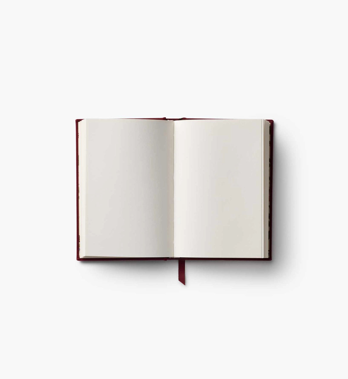 A mini hardcover journal, embroidered with delicate Gracie blooms and gold accents. Inside, find 240 blank, unlined pages and a ribbon bookmark.